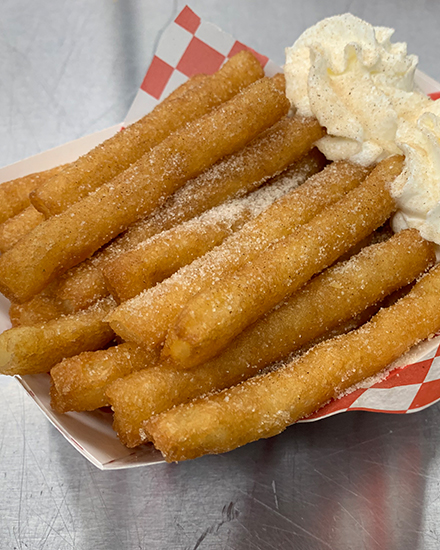 Funnel cake fries with powdered sugar
